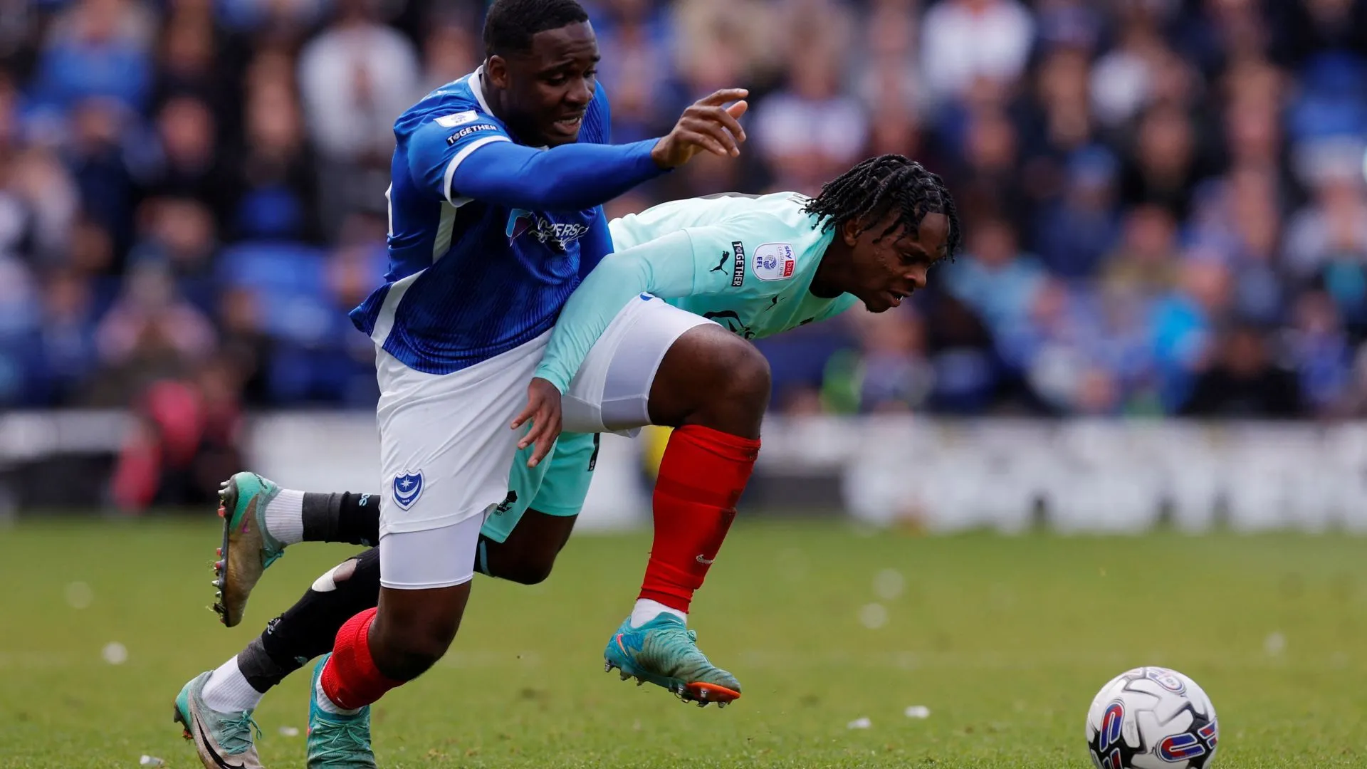 Christian Saydee trong màu áo Portsmouth trước khi chuyển đến Wigan Athletic